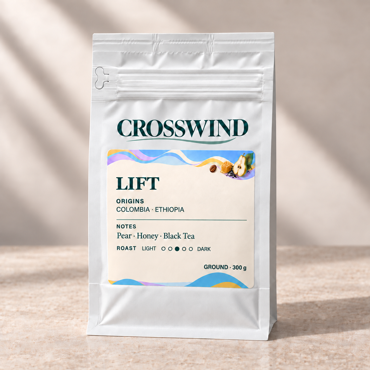 Crosswind Lift 300 g ground coffee in a sealed matte white pouch, labelled GROUND, with front zipper and left pull tab